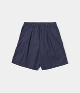 UNIVERSAL WORKS PLEATED TRACK SHORT 34151 PEACHED POPLIN NAVY - Shoelosophy