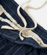 UNIVERSAL WORKS PLEATDED TRACK SHORT CHESTER STRIPE P34002 NAVY - Shoelosophy