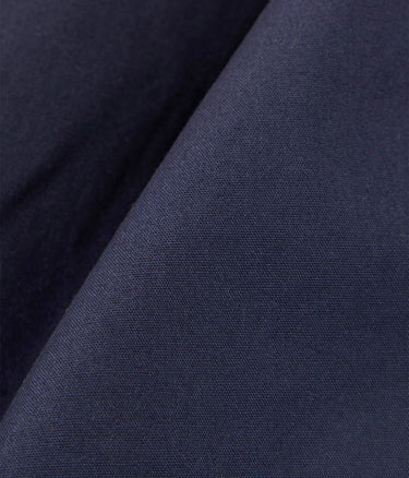UNIVERSAL WORKS PLEATED TRACK SHORT 34151 PEACHED POPLIN NAVY - Shoelosophy
