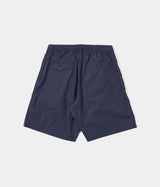 UNIVERSAL WORKS PLEATED TRACK SHORT 34151 PEACHED POPLIN NAVY - Shoelosophy