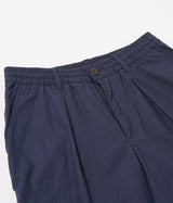 UNIVERSAL WORKS PLEATED TRACK SHORT 34151 PEACHED POPLIN NAVY - Shoelosophy
