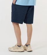 UNIVERSAL WORKS PLEATDED TRACK SHORT CHESTER STRIPE P34002 NAVY - Shoelosophy