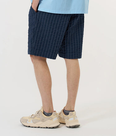 UNIVERSAL WORKS PLEATDED TRACK SHORT CHESTER STRIPE P34002 NAVY - Shoelosophy