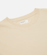 UNIVERSAL WORKS PRINT POCKET TEE ORGANIC JERSEY SAND - Shoelosophy