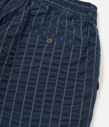 UNIVERSAL WORKS PLEATDED TRACK SHORT CHESTER STRIPE P34002 NAVY - Shoelosophy